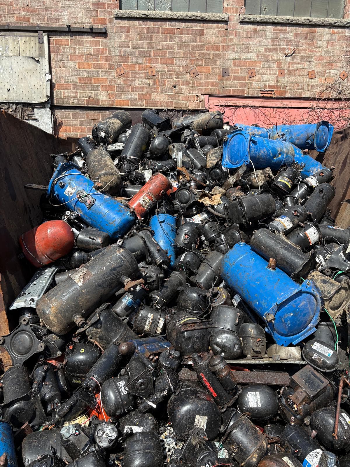 Large pile of scrap compressors and motors at Allied Metal Trading yard