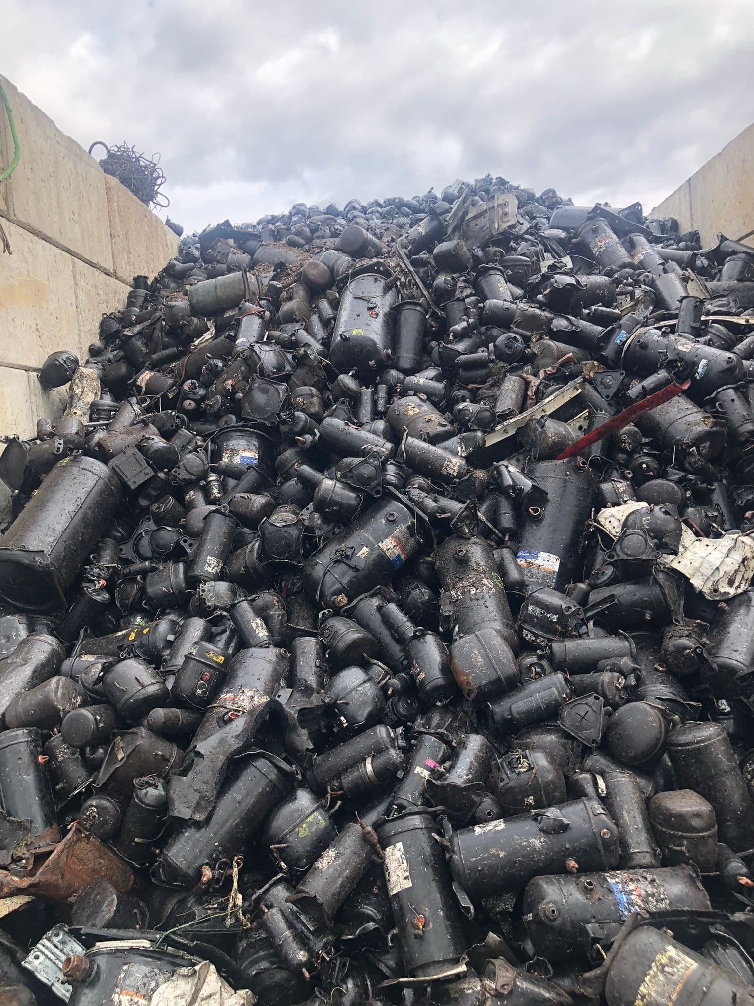 Large pile of scrap compressors at Allied Metal Trading facility